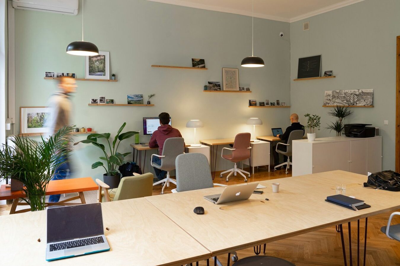 man in blue polo shirt sitting on chair