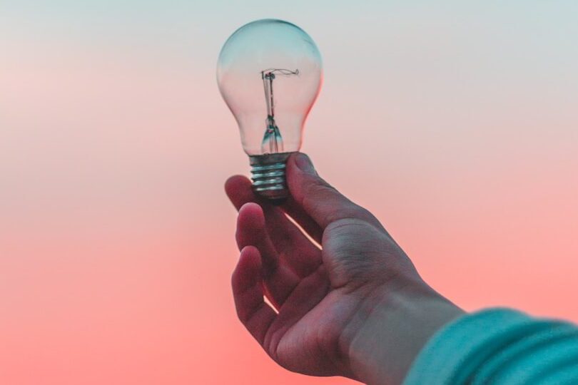 person holding light bulb